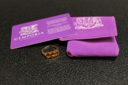 A 9K GOLD 'SPHENE' AND DIAMOND RING, with accompanying card certificate from Gemporia, approx weight