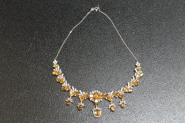 A WHITE METAL GEM SET DIAMOND AND CITRINE NECKLACE STAMPED 585, set with thirty one citrine style