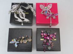 A BUTLER AND WILSON SHOE THEME BRACELET AND EARRING SET, together with three butterfly theme