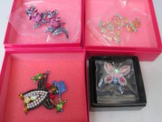 A COLLECTION OF FOUR BUTLER AND WILSON COSTUME BROOCHES, comprising a penguin with his catch of