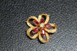 A RUBY AND DIAMOND PENDANT, set in unmarked yellow metal, approx weight 8.4g, Dia 3 cm