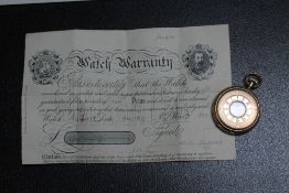 AN ELGIN ROLLED GOLD HALF HUNTER POCKET WATCH, with original guarantee, Dia 50cm