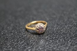 A HALLMARKED 18 CARAT GOLD AMETHYST AND DIAMOND RING, approx weight 3.4g, ring size O