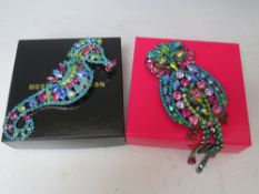 A LARGE BUTLER AND WILSON MULTI COLOUR CRYSTAL OWL BROOCH, H 16.5 cm, together with a similar Butler