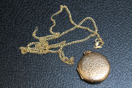 A HALLMARKED 9 CARAT GOLD LOCKET, Dia 3 cm, approx weight 8.5g, together with a 14K stamped yellow
