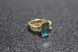 A HALLMARKED 9 CARAT GOLD DRESS RING, set with blue stones, approx weight 4.7g, ring size P