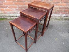 AN EASTERN NEST OF THREE TABLES, each with typical pierced scrolling detail