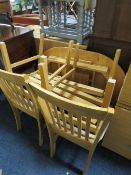 A MODERN BEECH KITCHEN TABLE AND FOUR CHAIRS