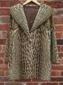 A VINTAGE ANIMAL PRINT FUR COATCondition Report:Internal underarm to underarm approx 49 cm