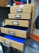 A VINTAGE DESKTOP FILING CABINET OF FIVE DRAWERS