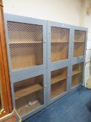 A MODERN LARGE THREE PIECE BOOKCASE WITH METAL GRILL DOORS W- 250CM