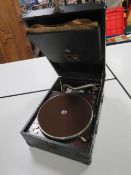 A VINTAGE PORTABLE WIND UP HMV RECORD PLAYER WITH HANDLE AND NEEDLE, IN WORKING ORDER AT THE TIME OF