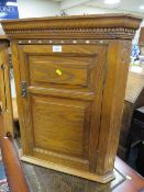 AN ANTIQUE OAK HANGING CORNER CUPBOARD WITH MOTHER-OF-PEARL INLAY