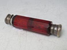 A VICTORIAN DOUBLE CRANBERRY GLASS SCENT BOTTLE, with white metal tops, L 12 cm