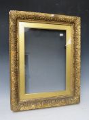 A 19TH CENTURY GOLD FRAME, with gold slip and outer leaf design, glazed, with some restoration,