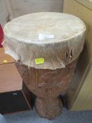 A CARVED TRIBAL STYLE ANIMAL SKIN DRUM APPROX HEIGHT 68CM