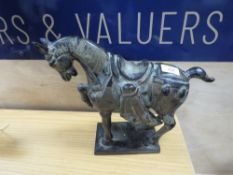 A CAST METAL TANG STYLE HORSE