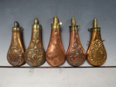 FIVE 19TH CENTURY COPPER AND BRASS SHOT FLASKS, average L 20 cm