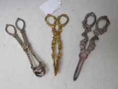 A PAIR OF 19TH CENTURY GILT SUGAR NIPS, together with a silver plated pair of grape scissors (2)
