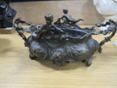 A TWIN HANDLED VICTORIAN TYPE CHERUBIC TABLE STAND