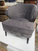 A MODERN GREY SUEDE ARMCHAIR