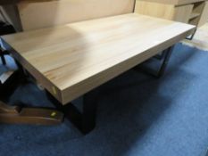 A MODERN LOW COFFEE TABLE WITH METAL LEGS