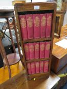 A SMALL OPEN BOOKCASE TOGETHER WITH FIFTEEN CHARLES DICKENS NOVELS