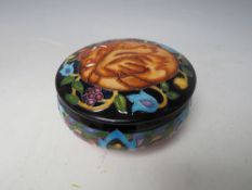 A MOORCROFT TRIAL CIRCULAR POWDER BOWL AND COVER, Dia. 12.5 cm