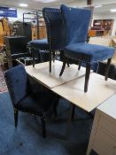 A MODERN EXTENDING LIMED DINING TABLE WITH FOUR BLUE UPHOLSTERED CHAIRS