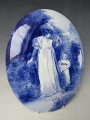 A LARGE 19TH CENTURY OVAL PORCELAIN PLAQUE, depicting a mother and child walking on a path, 37 x