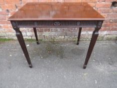 A 19TH CENTURY MAHOGANY SILVER TABLE, the frieze with carved detail and rosettes, raised on