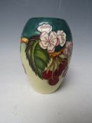 A MOORCROFT CHERRY BLOSSOM PATTERN SMALL BALUSTER VASE, H 13.5 cm