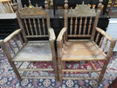 A PAIR OF ANTIQUE CARVED OAK ARMCHAIRS