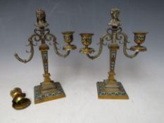 A PAIR OF 19TH CENTURY CHAMPLEVE BRASS TWO BRANCH CANDELABRA, one A/F, H 24 cm