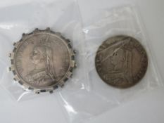 A VICTORIAN DOUBLE FLORIN SET IN A MOUNT 1887, together with another 1890 (2)