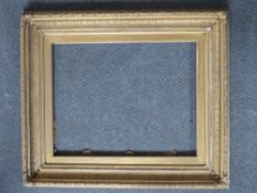 A 19TH CENTURY DECORATIVE GOLD FRAME, with gold slip, frame W 9 cm, slip rebate 60 x 47 cm, frame