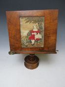 A 19TH CENTURY WALNUT ADJUSTABLE READING STAND, with needlepoint rectangular panel