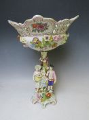 A LARGE CONTINENTAL PORCELAIN FLORAL ENCRUSTED TABLE CENTREPIECE, with figurative details, marked '