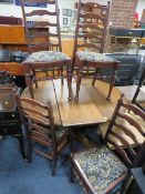 AN EXTENDING ERCOL STYLE DINING TABLE WITH SIX CHAIRS