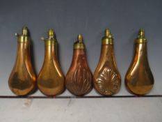 FIVE 19TH CENTURY COPPER AND BRASS SHOT FLASKS, average L 19 cm