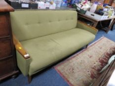 A MID CENTURY UPHOLSTERED SETTEE