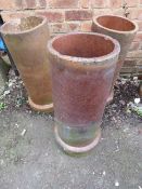 THREE TERRACOTTA CHIMNEY POT PLANTERS