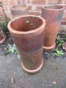 THREE TERRACOTTA CHIMNEY POT PLANTERS