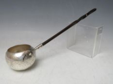 A 19TH CENTURY WHITE METAL TODDY LADLE, with ebonised handle, overall L 36 cm