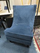 A MODERN BLUE STUDDED LARGE CHAIR