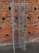 A BANK OF FOUR LOCKING CAGES / LOCKERS