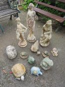 A COLLECTION OF THIRTEEN CONCRETE GARDEN STATUES TO INCLUDE FEMALE FIGURES