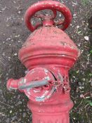 A LARGE RED VINTAGE FIRE / WATER HYDRANTS