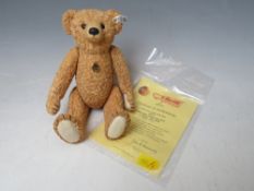 A CERAMIC 100th ANNIVERSARY LIMITED EDITION STEIFF BEAR, with certificate, having jointed limbs H