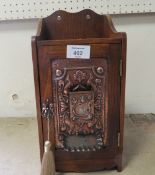 AN ARTS & CRAFTS SMOKERS CABINET WITH KEY